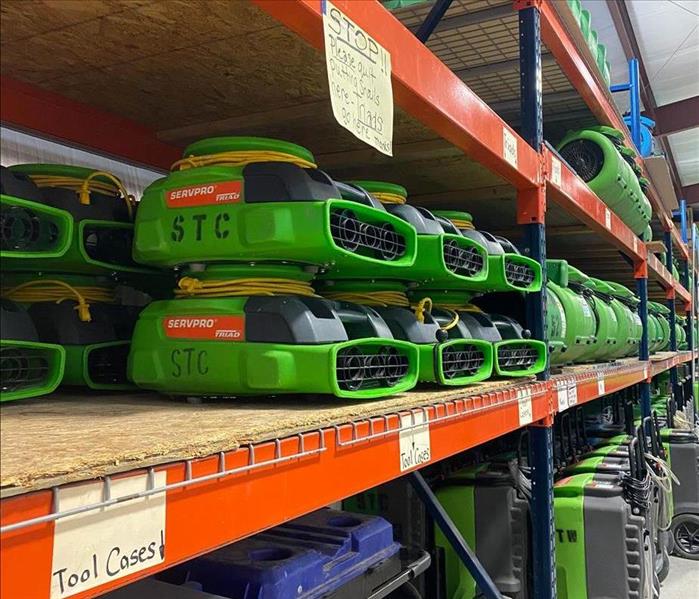green equipment on a shelf 