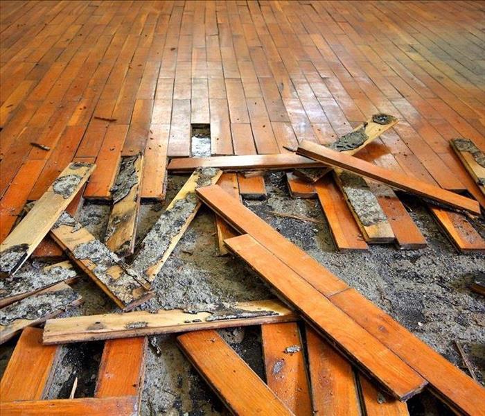 wooden floor damaged by flood waters